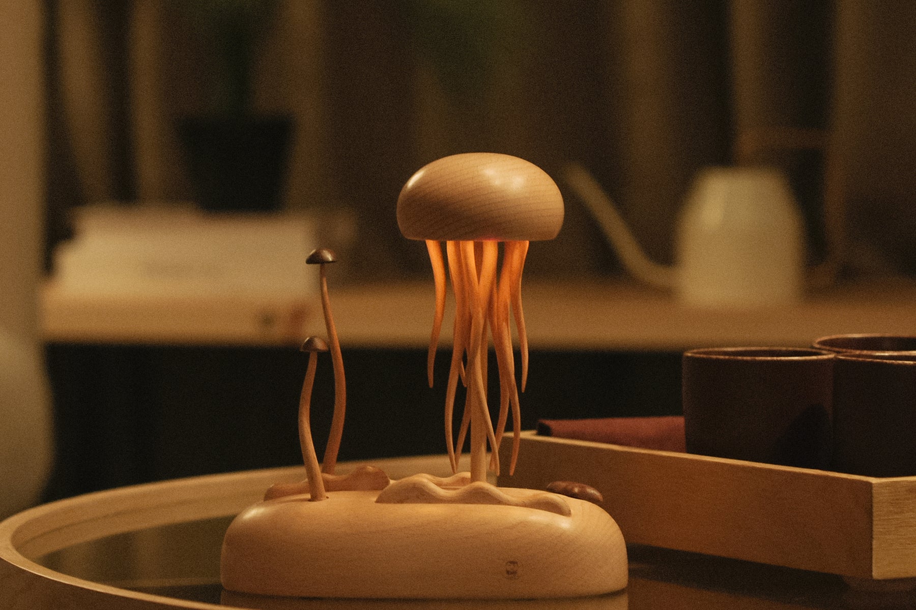 Wooden Jellyfish Lamp by Baigu Uncle with soft light, slow movement, and wooden details