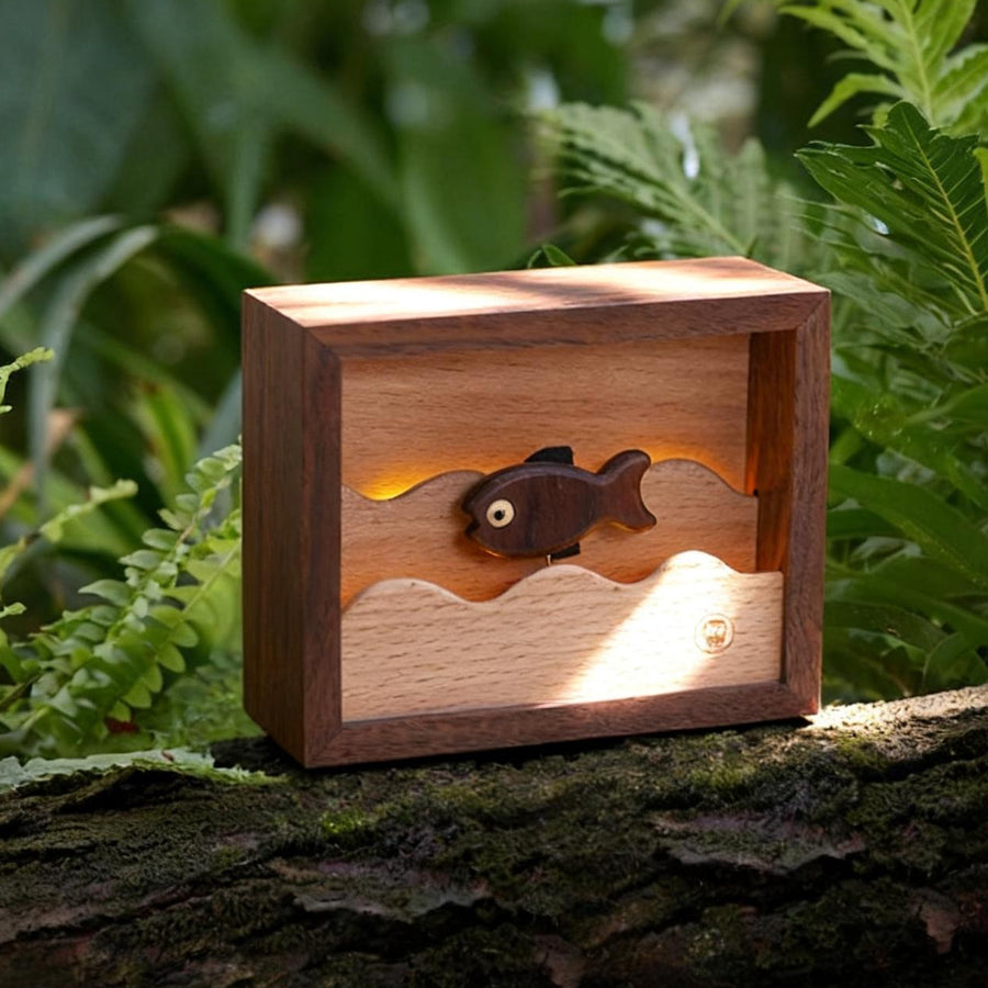 Wooden Little Fish Lamp by Baigu Uncle with warm night light and wooden fish detail